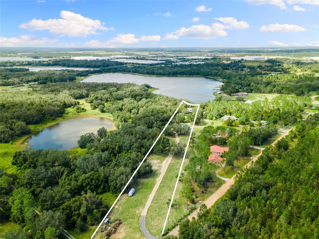 18725 South Obrien Road Groveland, FL 34736 - Photo 5 of 68 a view of a lake and a yard