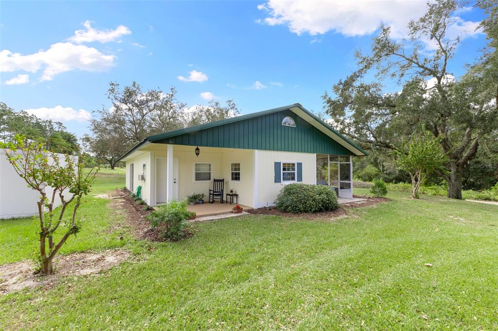 18725 South Obrien Road Groveland, FL 34736 - Photo 54 of 68 a view of a house with backyard and sitting area