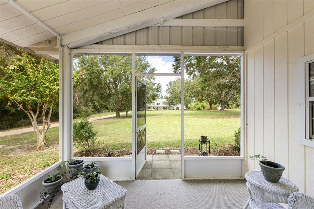 18725 South Obrien Road Groveland, FL 34736 - Photo 56 of 68 a room with furniture and a floor to ceiling window window