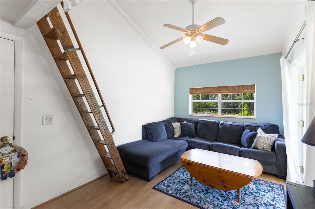 18725 South Obrien Road Groveland, FL 34736 - Photo 58 of 68 a living room with furniture and a window