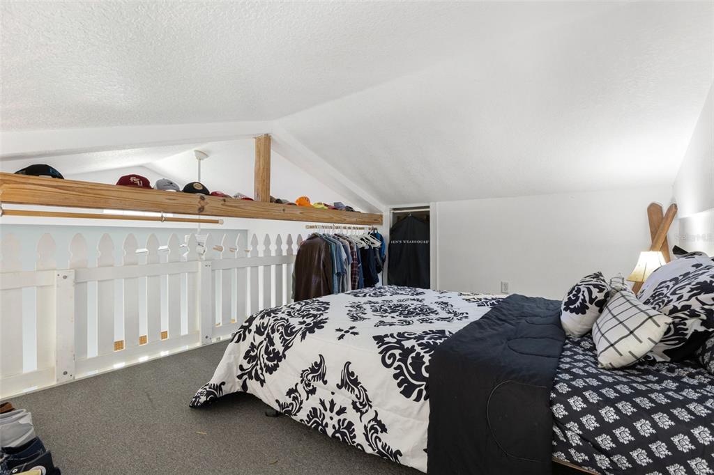 18725 South Obrien Road Groveland, FL 34736 - Photo 59 of 68 a bed sitting in a bedroom next to a window with dresser