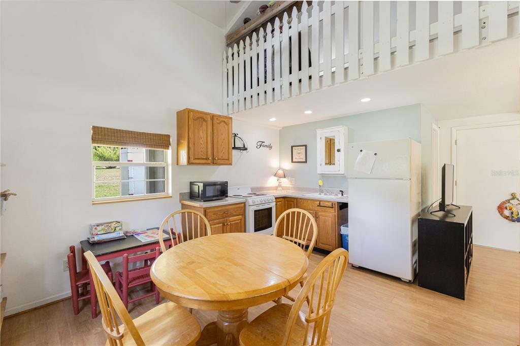 18725 South Obrien Road Groveland, FL 34736 - Photo 60 of 68 a dining room with furniture and a window