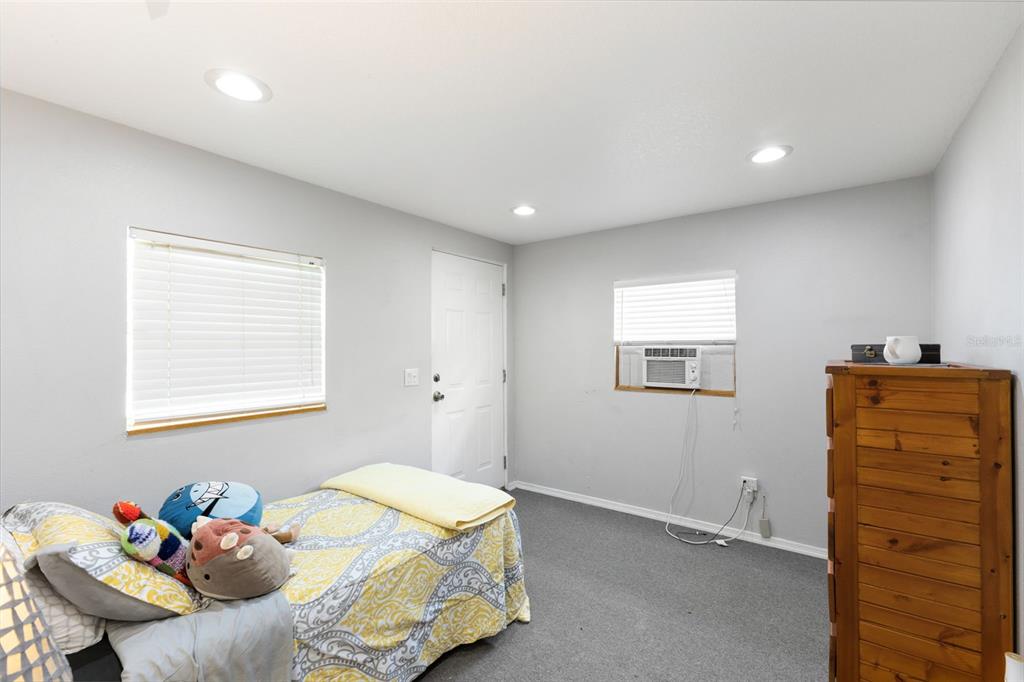 18725 South Obrien Road Groveland, FL 34736 - Photo 61 of 68 a bedroom with a bed and furniture