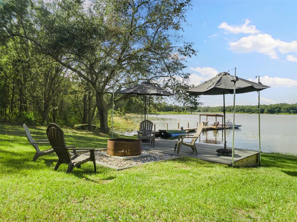 18725 South Obrien Road Groveland, FL 34736 - Photo 8 of 68 a view of a table and chairs in the garden