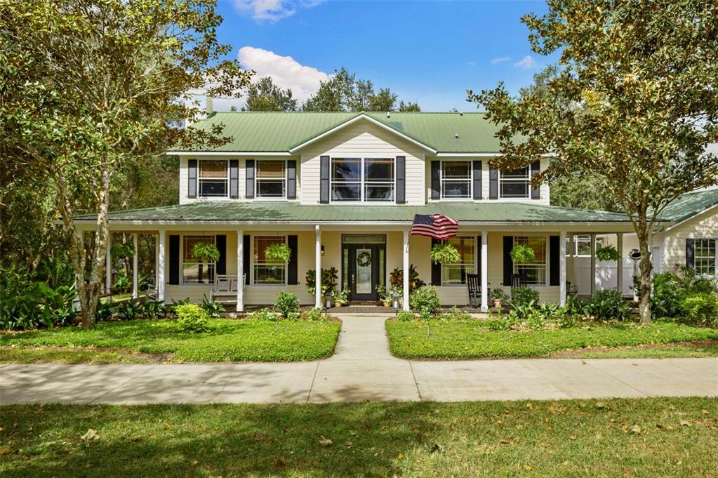 18725 South Obrien Road Groveland, FL 34736 - Photo 9 of 68 a front view of a house with a yard