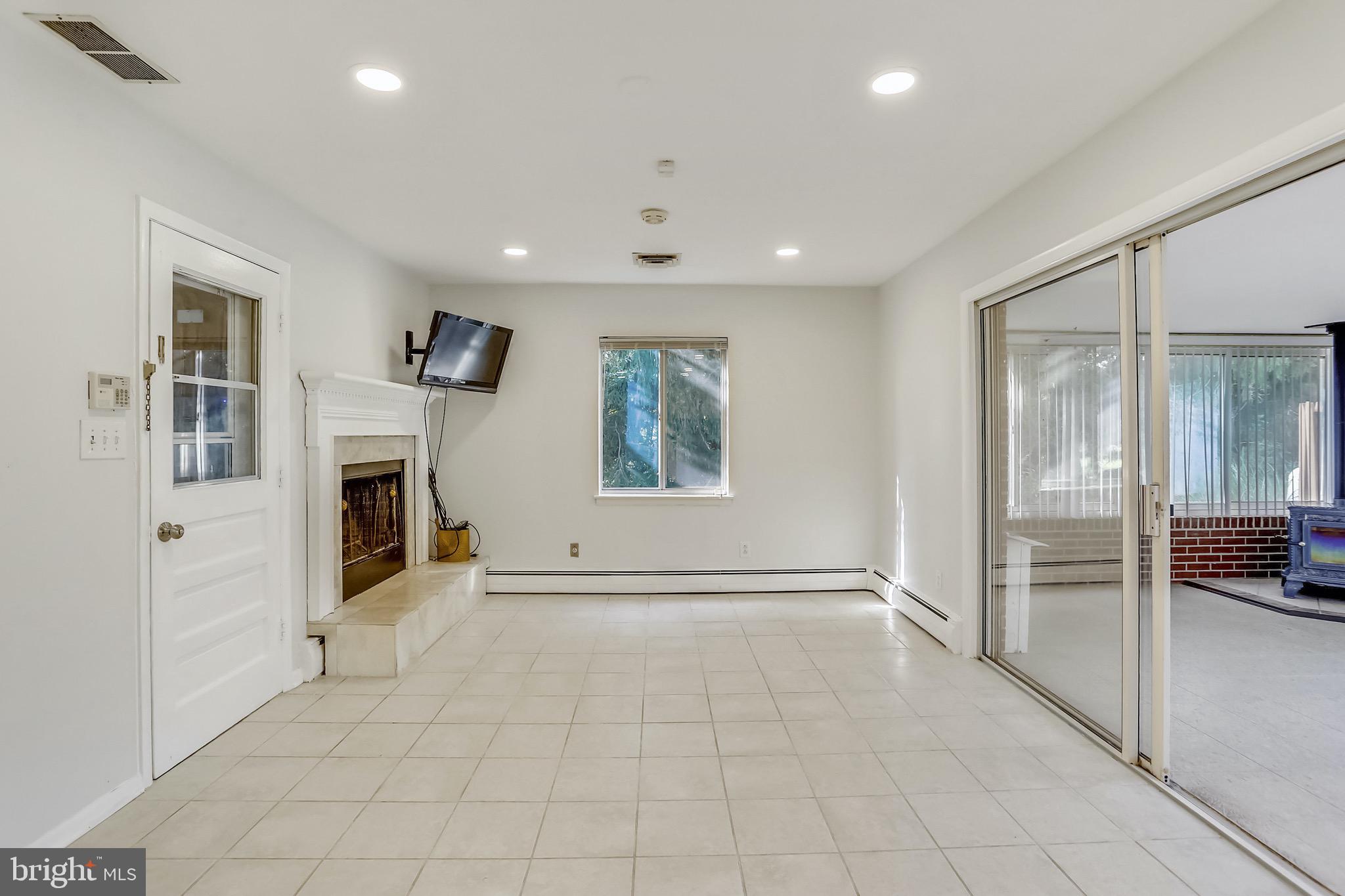 15600 Layhill Road Silver Spring, MD 20906 - Photo 21 of 63 Family room 1st floor w/fireplace