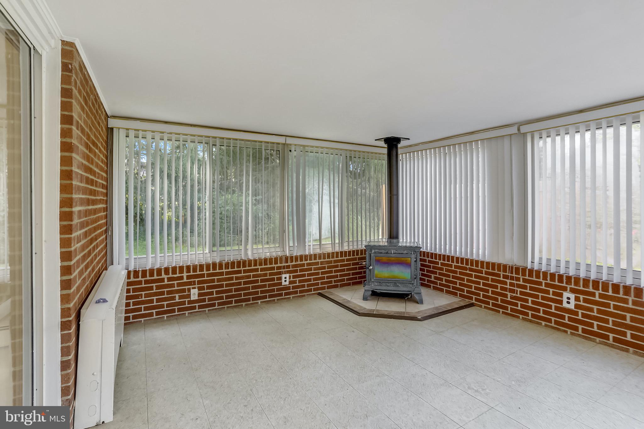 15600 Layhill Road Silver Spring, MD 20906 - Photo 23 of 63 Solarium w/wood stove