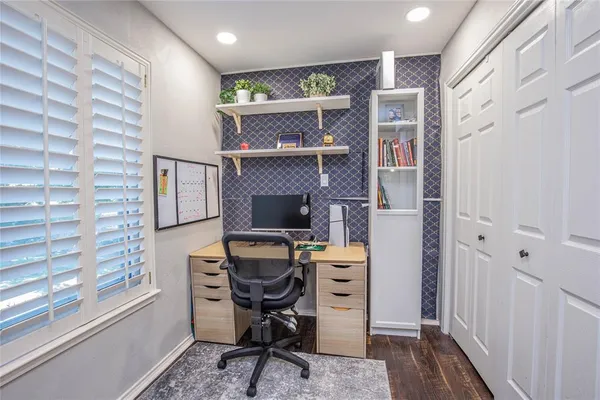 a workspace with furniture and window