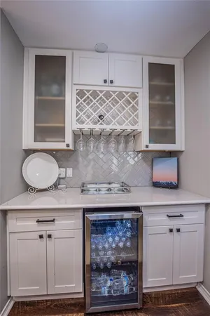 a bathroom with granite countertop a sink a vanity and window