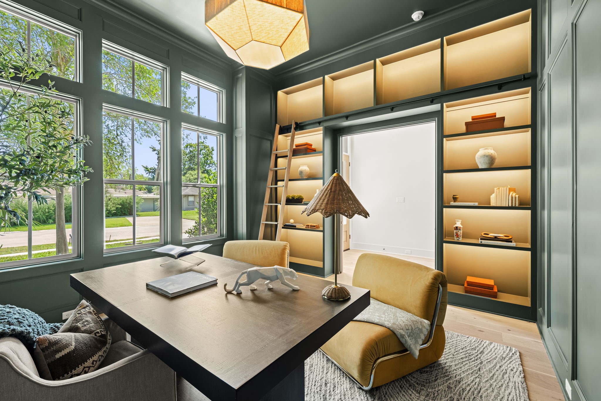 1414 Chamboard Lane Houston, TX 77018 - Photo 2 of 37 Elegant study features backlit shelves with rolling ladder and spacious walk-in closet with hidden door.