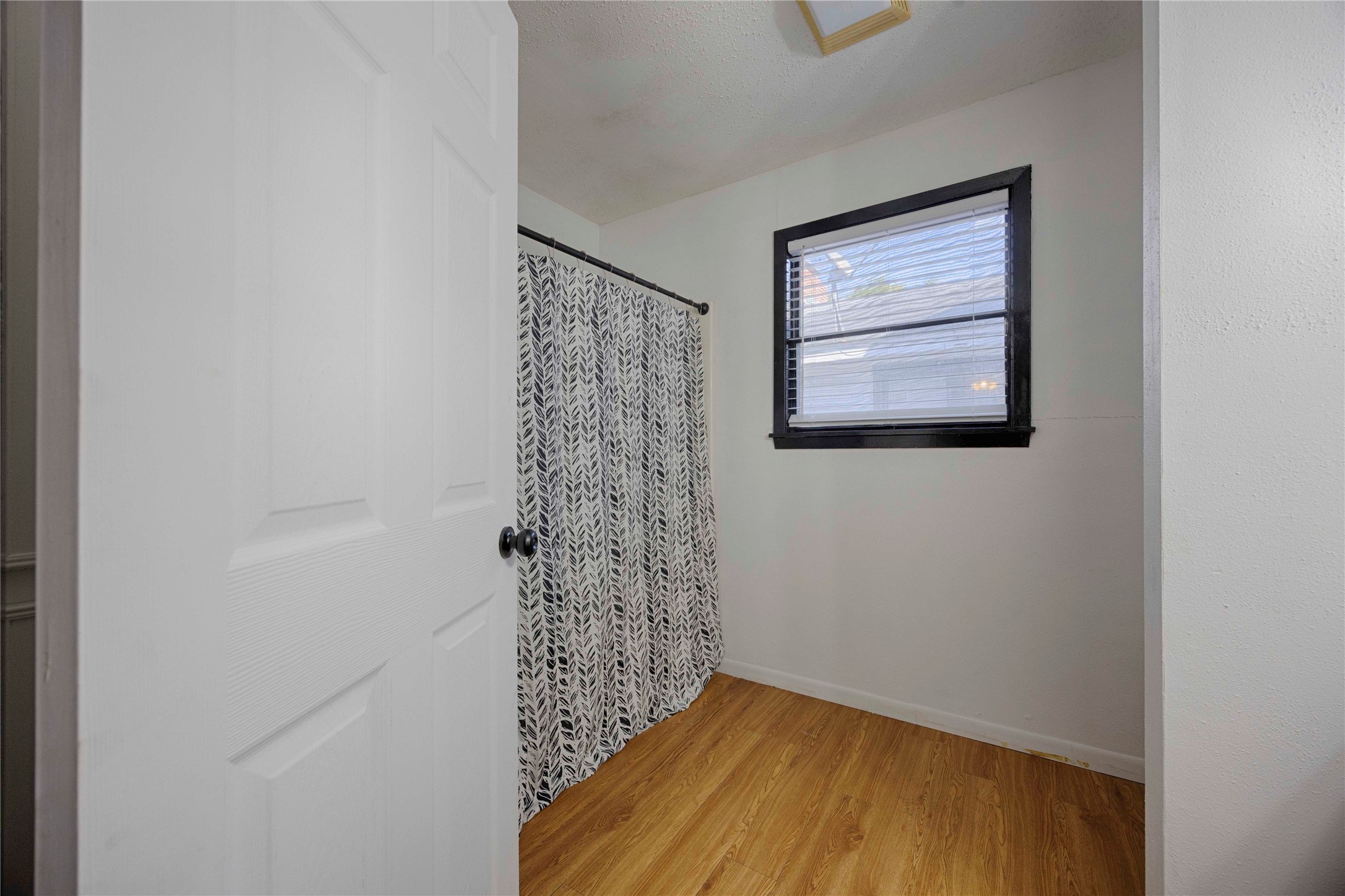 909 Eilers Street Schulenburg, TX 78956 - Photo 22 of 33 a view of a hallway with wooden floor and a window