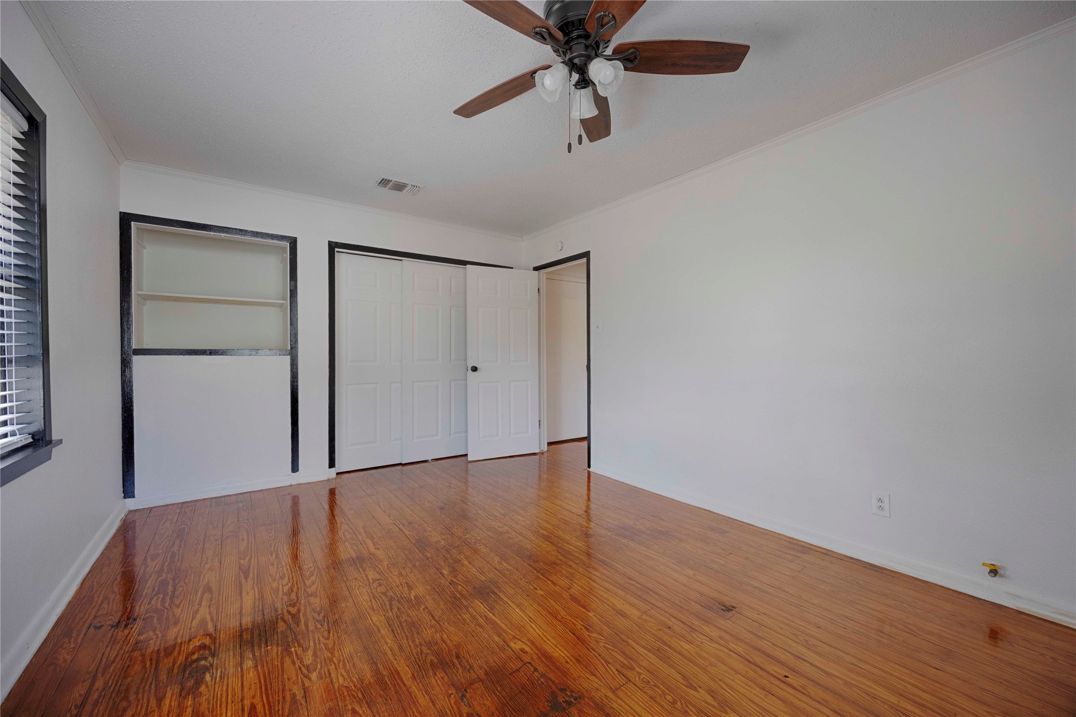 909 Eilers Street Schulenburg, TX 78956 - Photo 24 of 33 a view of an empty room with wooden floor