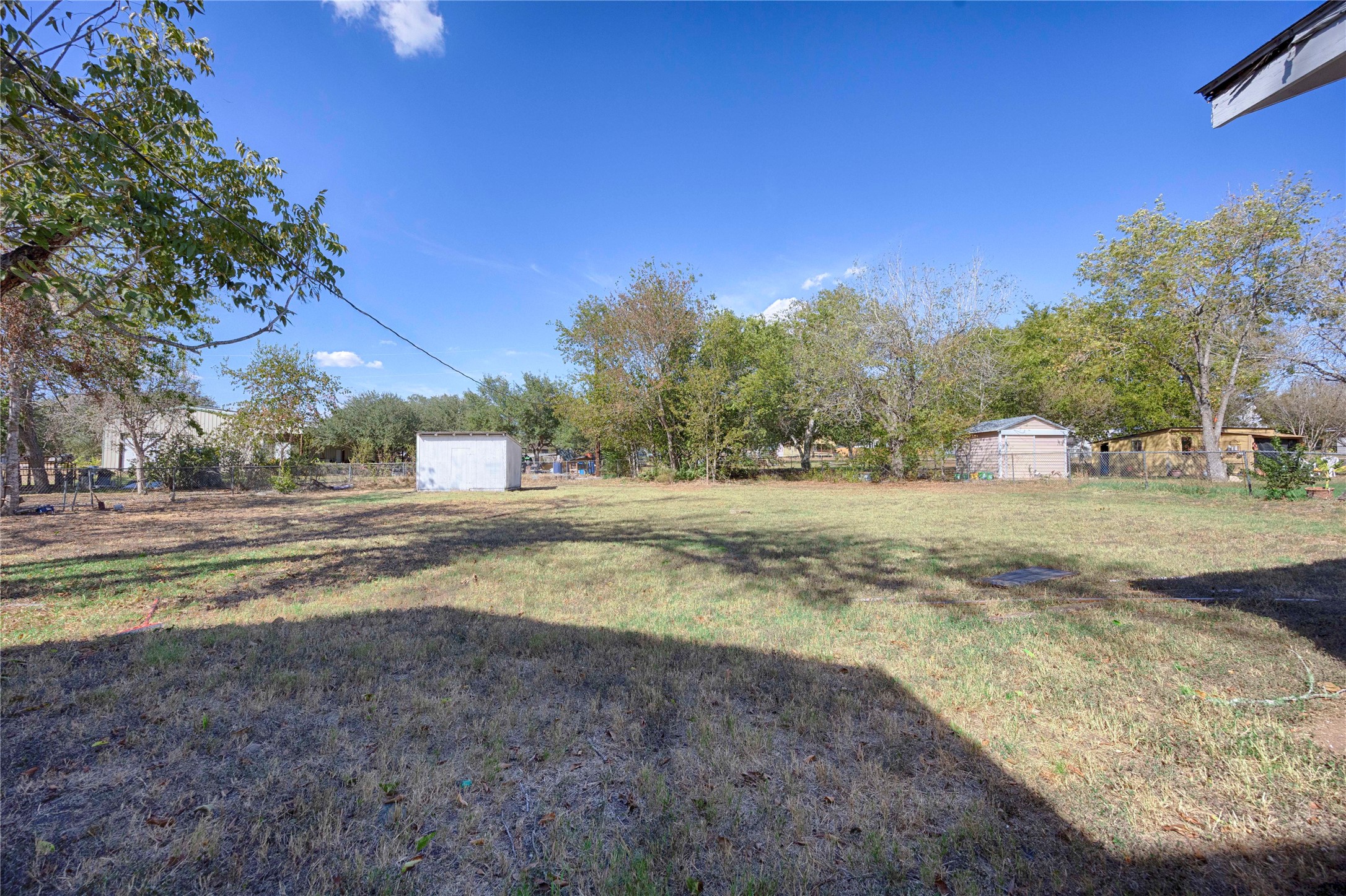 909 Eilers Street Schulenburg, TX 78956 - Photo 32 of 33 a view of dirt yard with a large trees