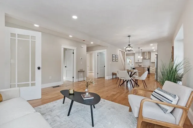 a living room with furniture and a table