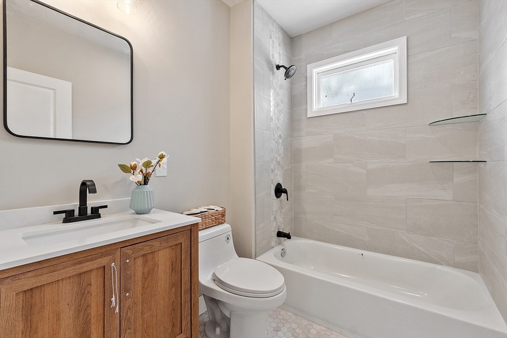 42 North Worcester Avenue Worcester, MA 01606 - Photo 13 of 24 a bathroom with a sink a toilet and a mirror