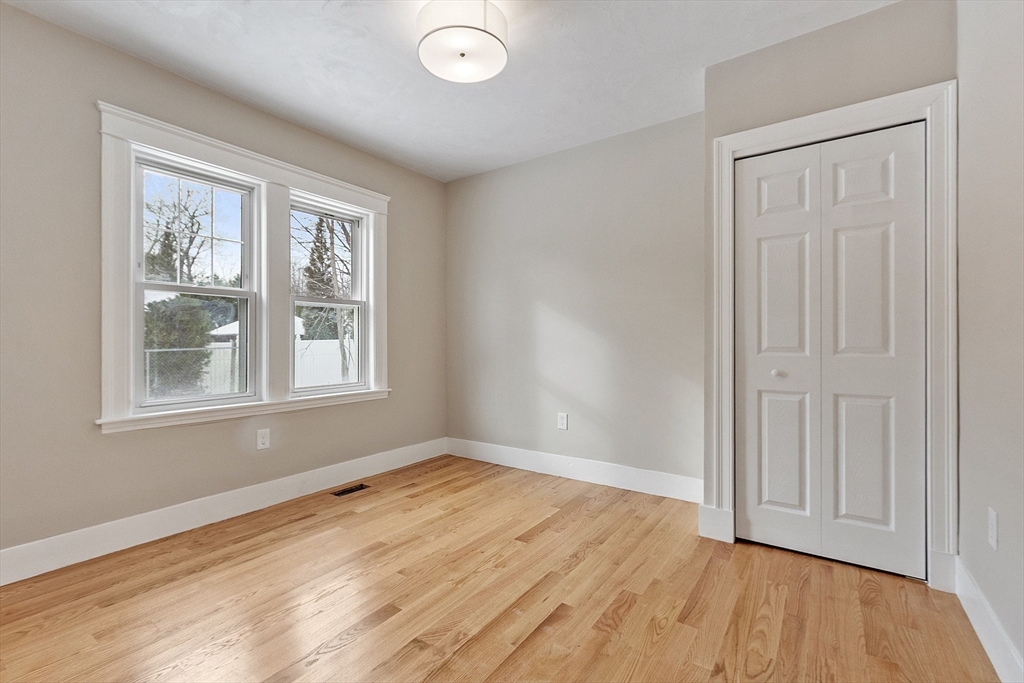 42 North Worcester Avenue Worcester, MA 01606 - Photo 15 of 24 an empty room with wooden floor and windows