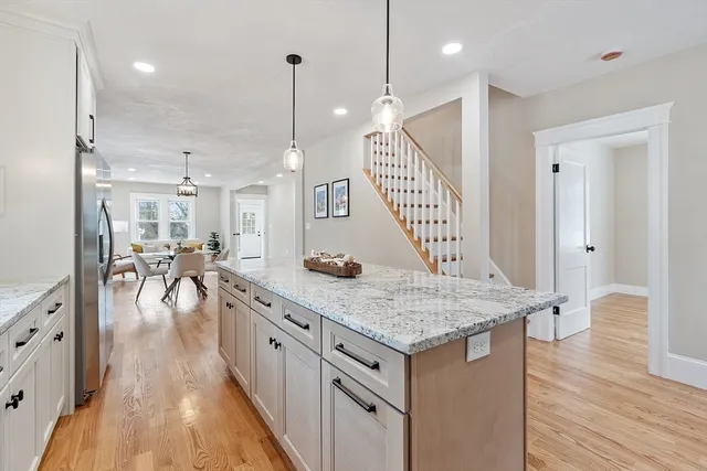a kitchen with counter space and wooden floor