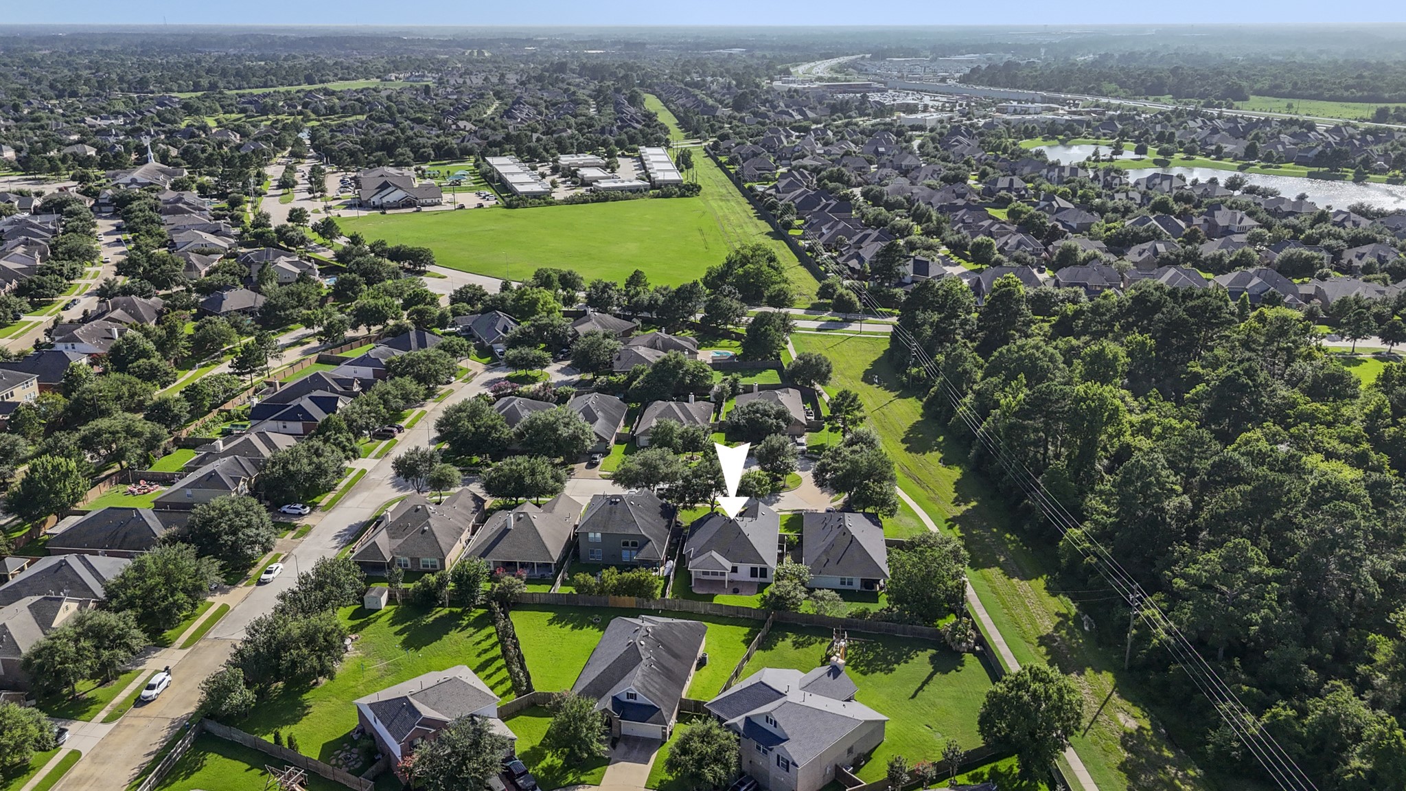 20014 Queens Oak Court Spring, TX 77379 - Photo 34 of 49 an aerial view of residential houses with outdoor space