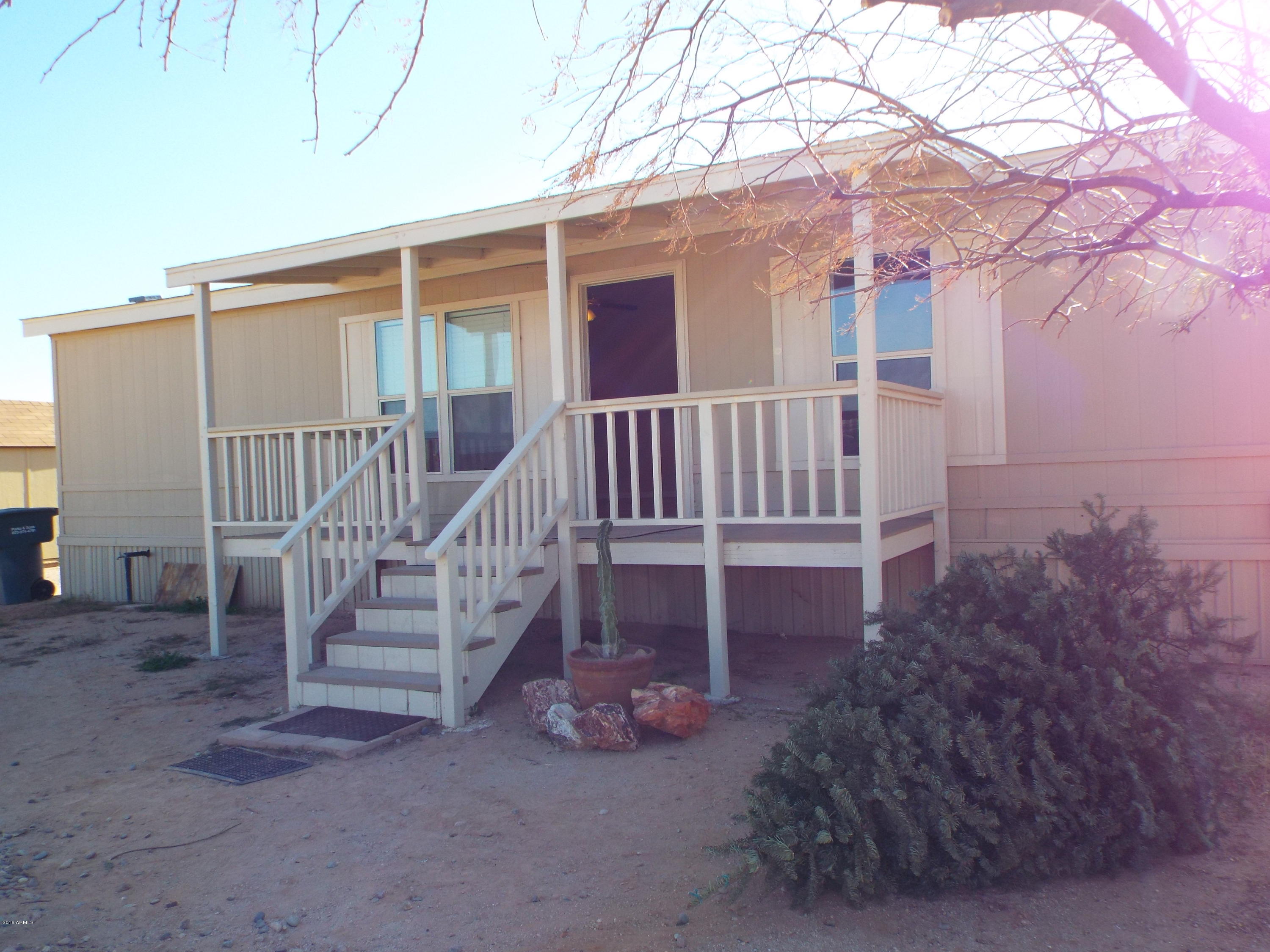 20843 West Teepee Road Buckeye, AZ 85326 - Photo 29 of 29 a view of a house with wooden deck and a backyard