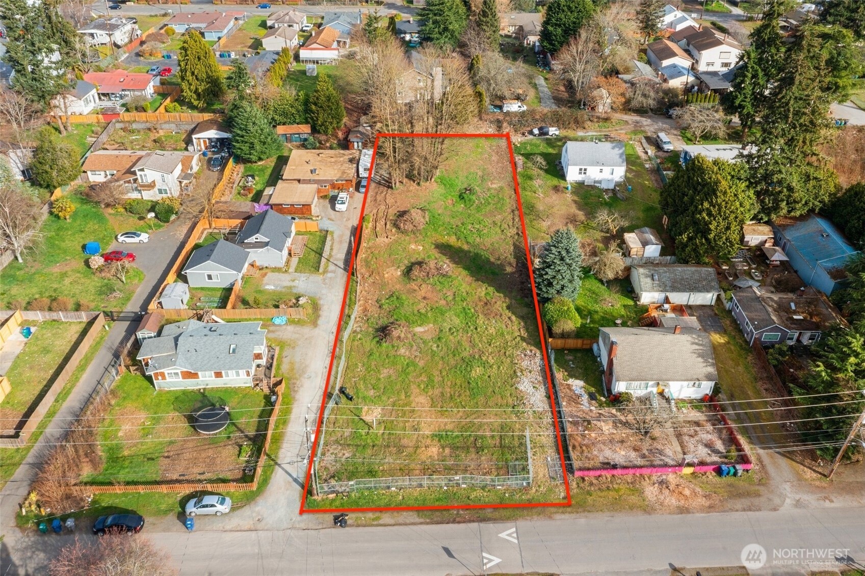 an aerial view of residential houses with outdoor space
