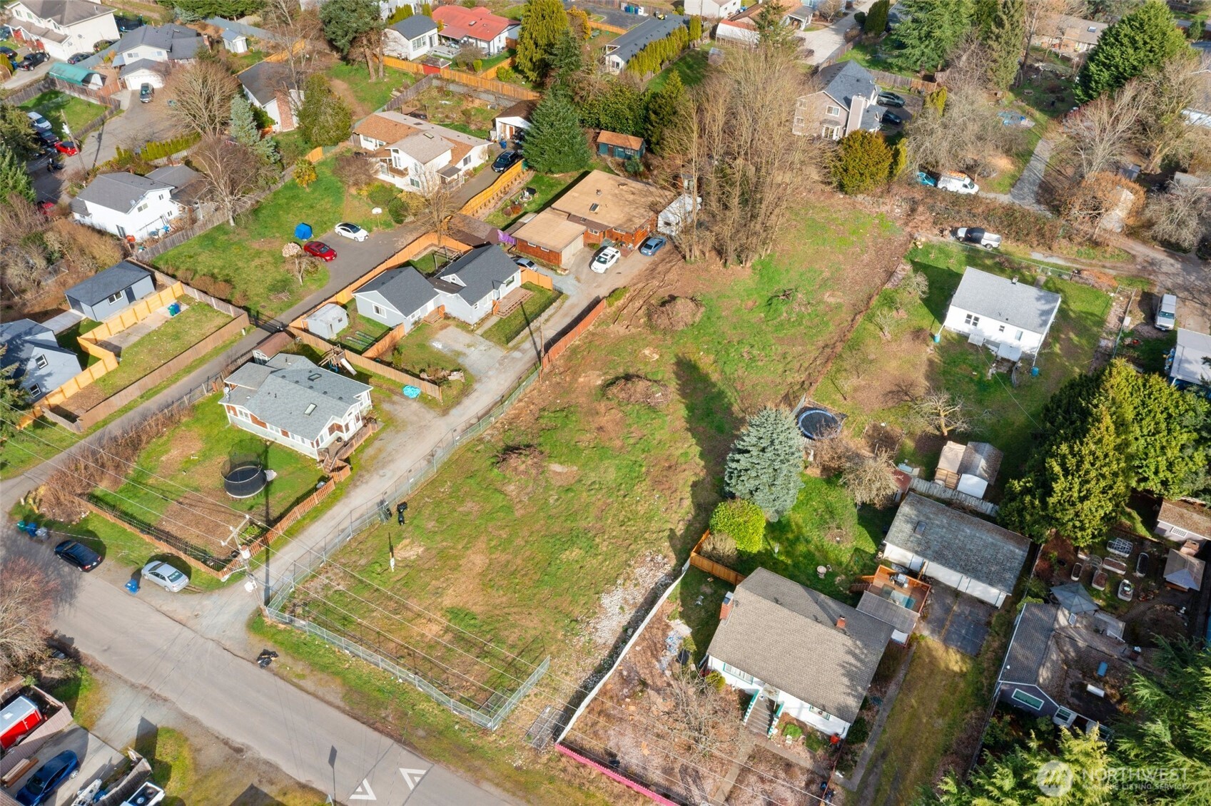 9806 30th Avenue Southwest Seattle, WA 98126 - Photo 6 of 15 an aerial view of residential houses with outdoor space