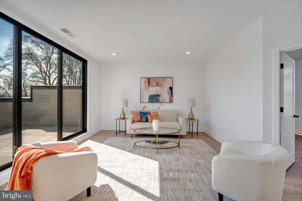a spacious bedroom with a bed and furniture