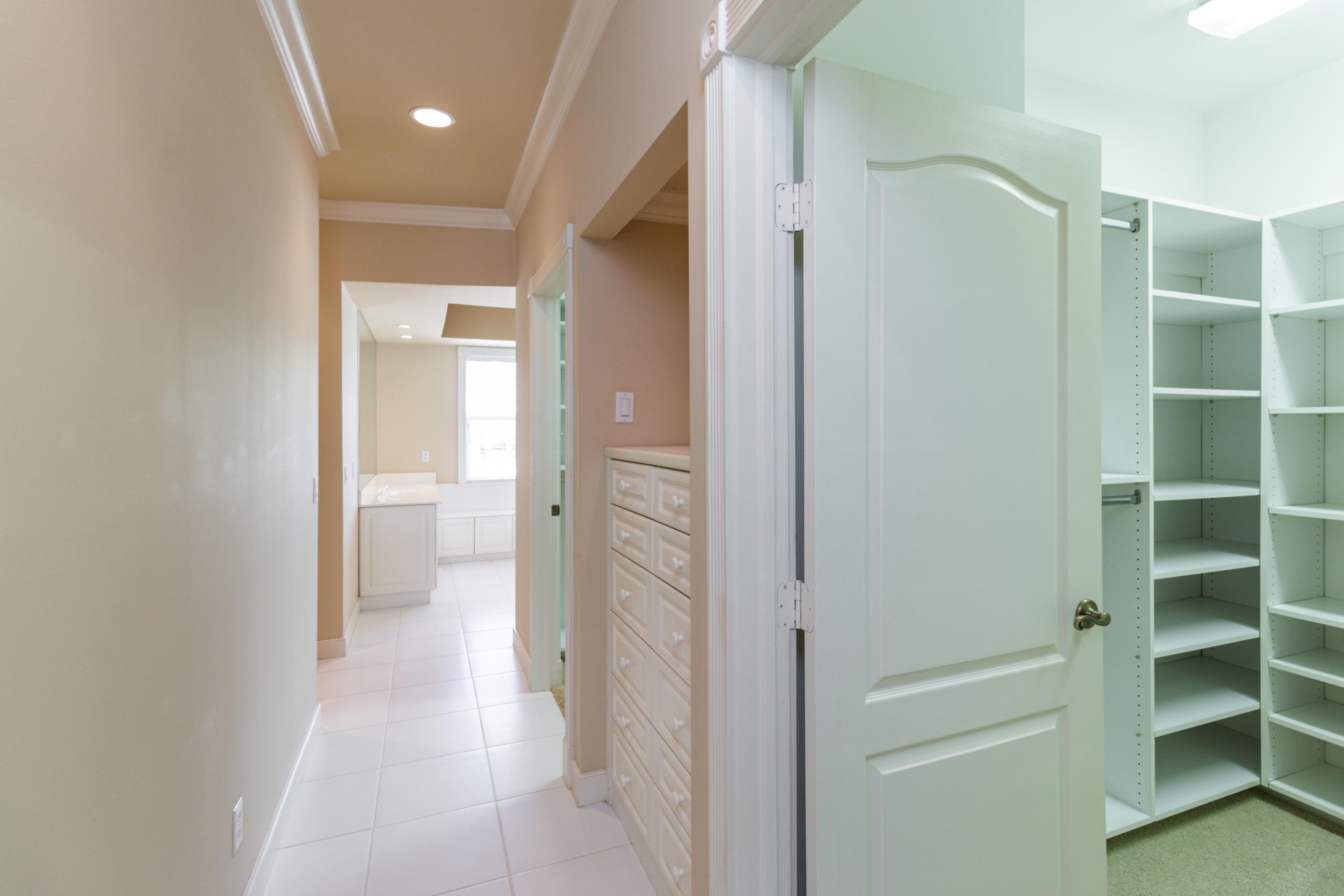 36 West High Point Road Sewall's Point, FL 34996 - Photo 16 of 31 16_36WHighPointRd_45_MasterBedroomCloset