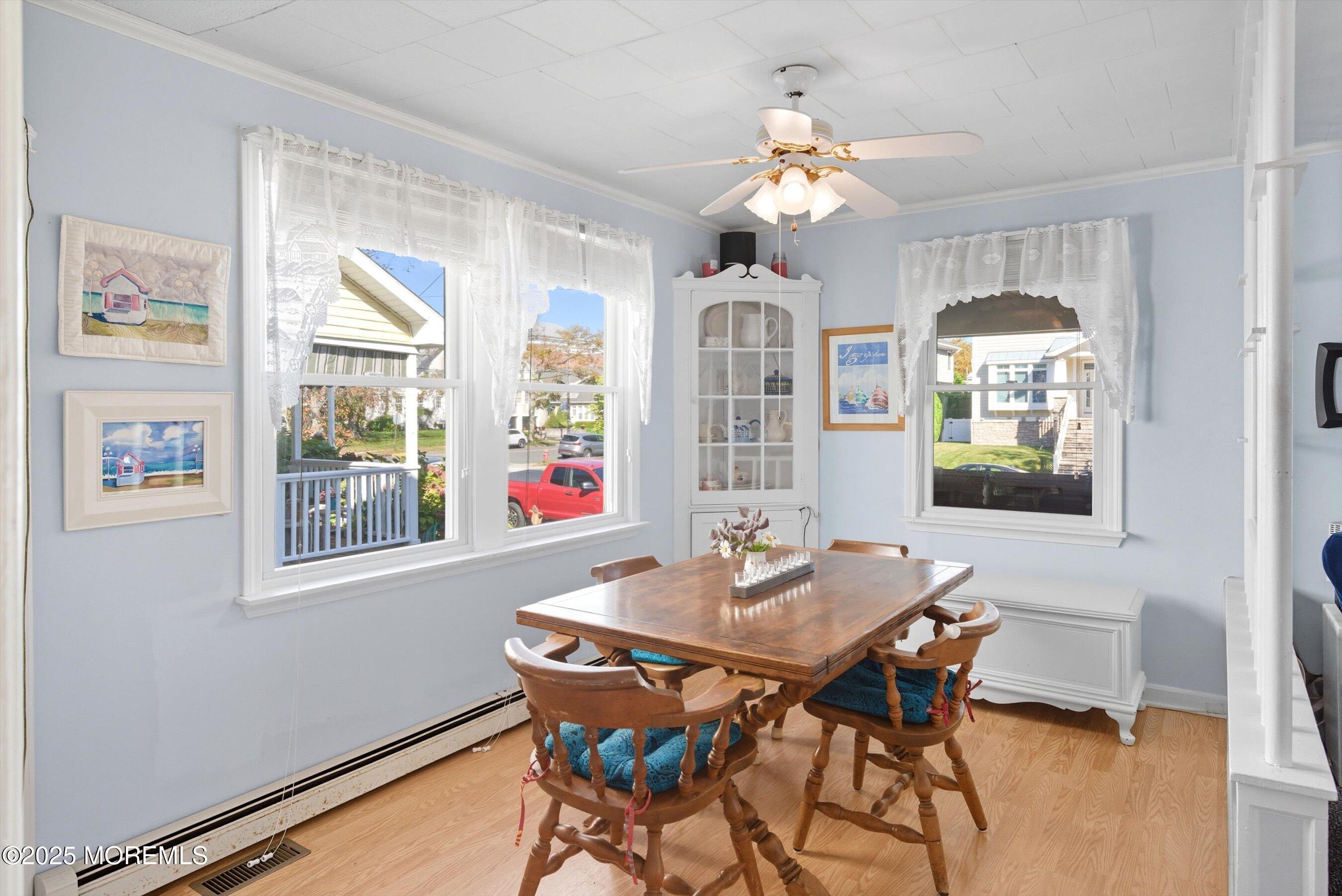 425 Washington Avenue Avon-by-the-Sea, NJ 07717 - Photo 12 of 41 a view of a dining room with furniture and chandelier