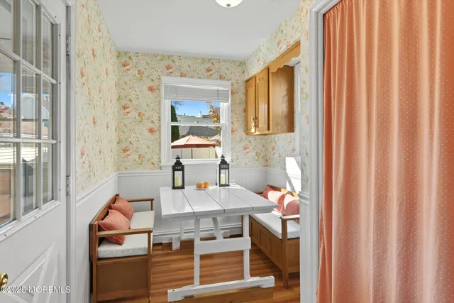 a view of a bedroom with furniture and window