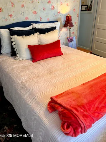 a bedroom with a bed and closet