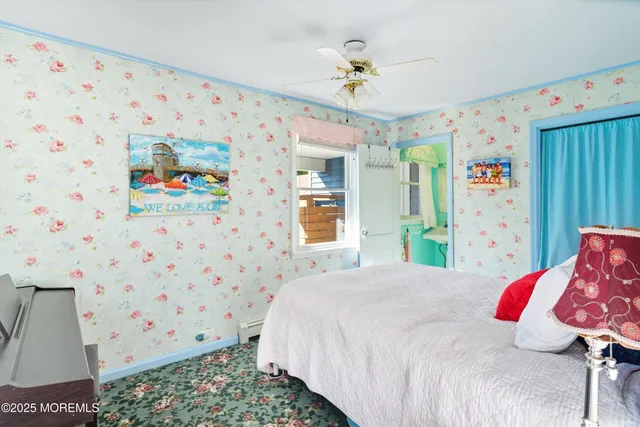 a bedroom with a bed and a dresser in it