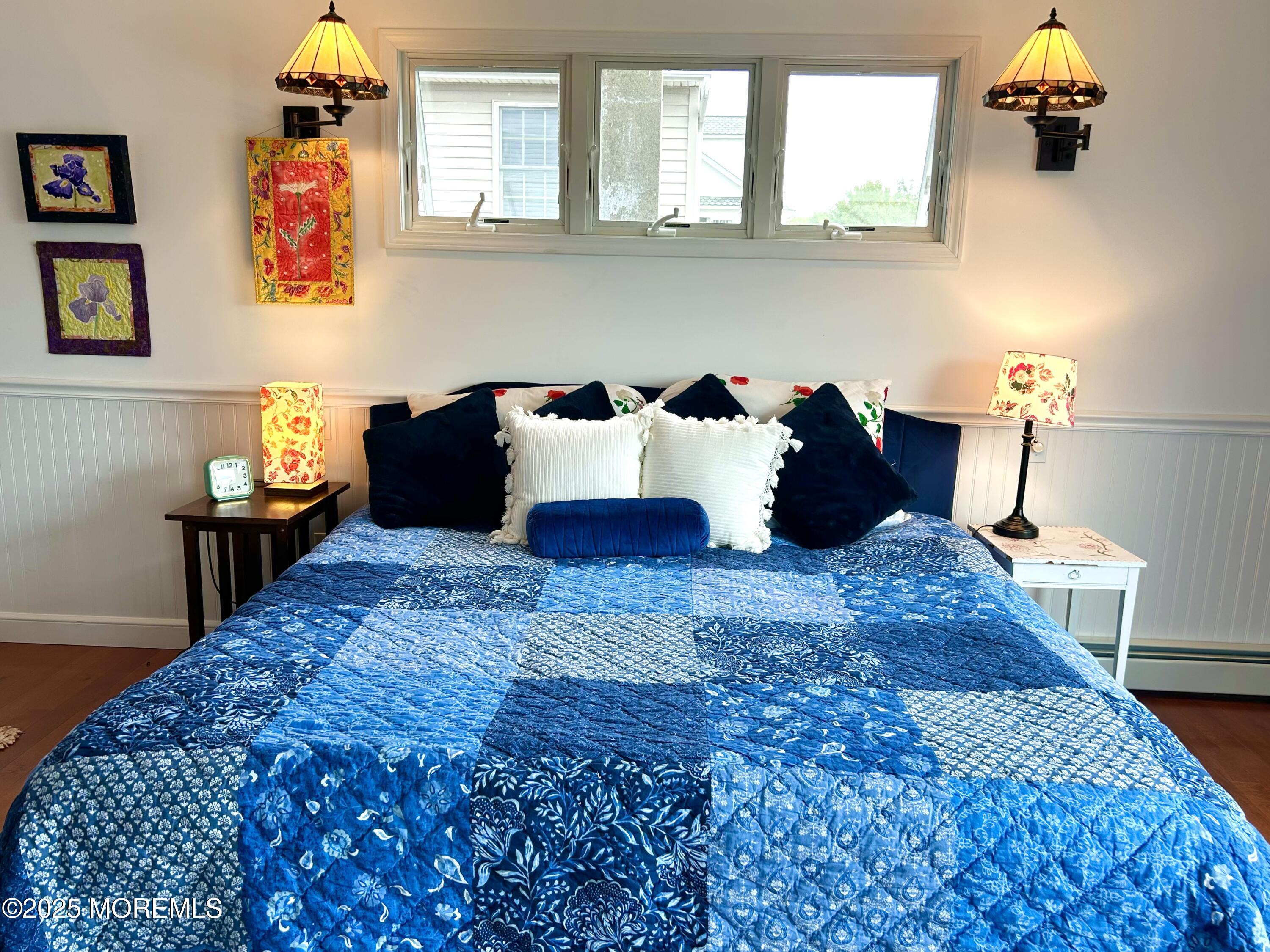 425 Washington Avenue Avon-by-the-Sea, NJ 07717 - Photo 24 of 41 a bedroom with a bed and wooden floor