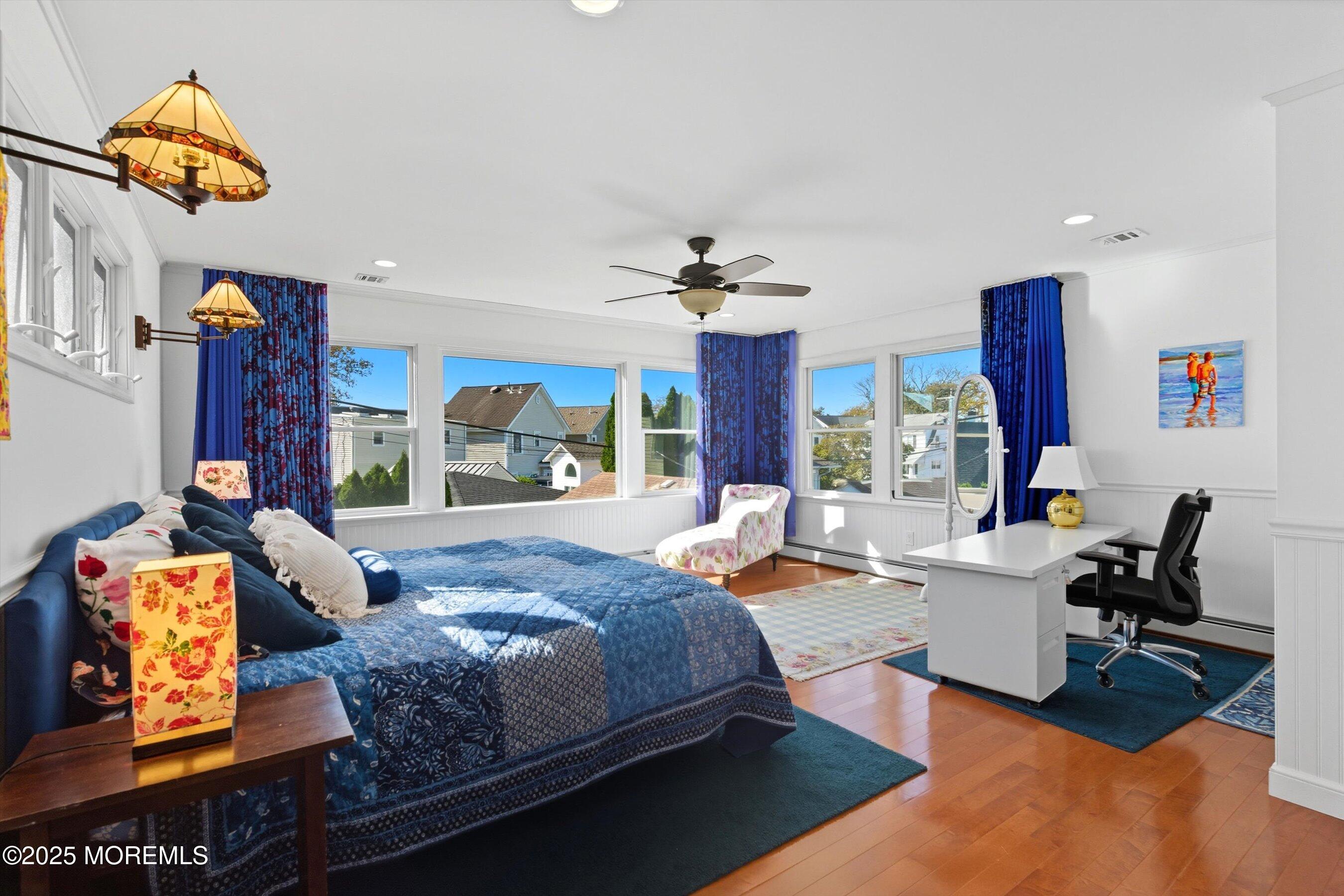 425 Washington Avenue Avon-by-the-Sea, NJ 07717 - Photo 25 of 41 a bedroom with a bed and a window