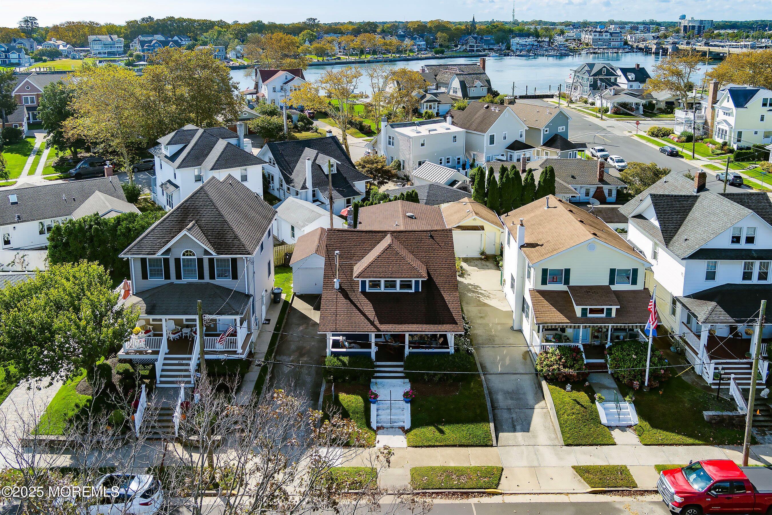 425 Washington Avenue Avon-by-the-Sea, NJ 07717 - Photo 4 of 41 an aerial view of multiple houses with a lake view