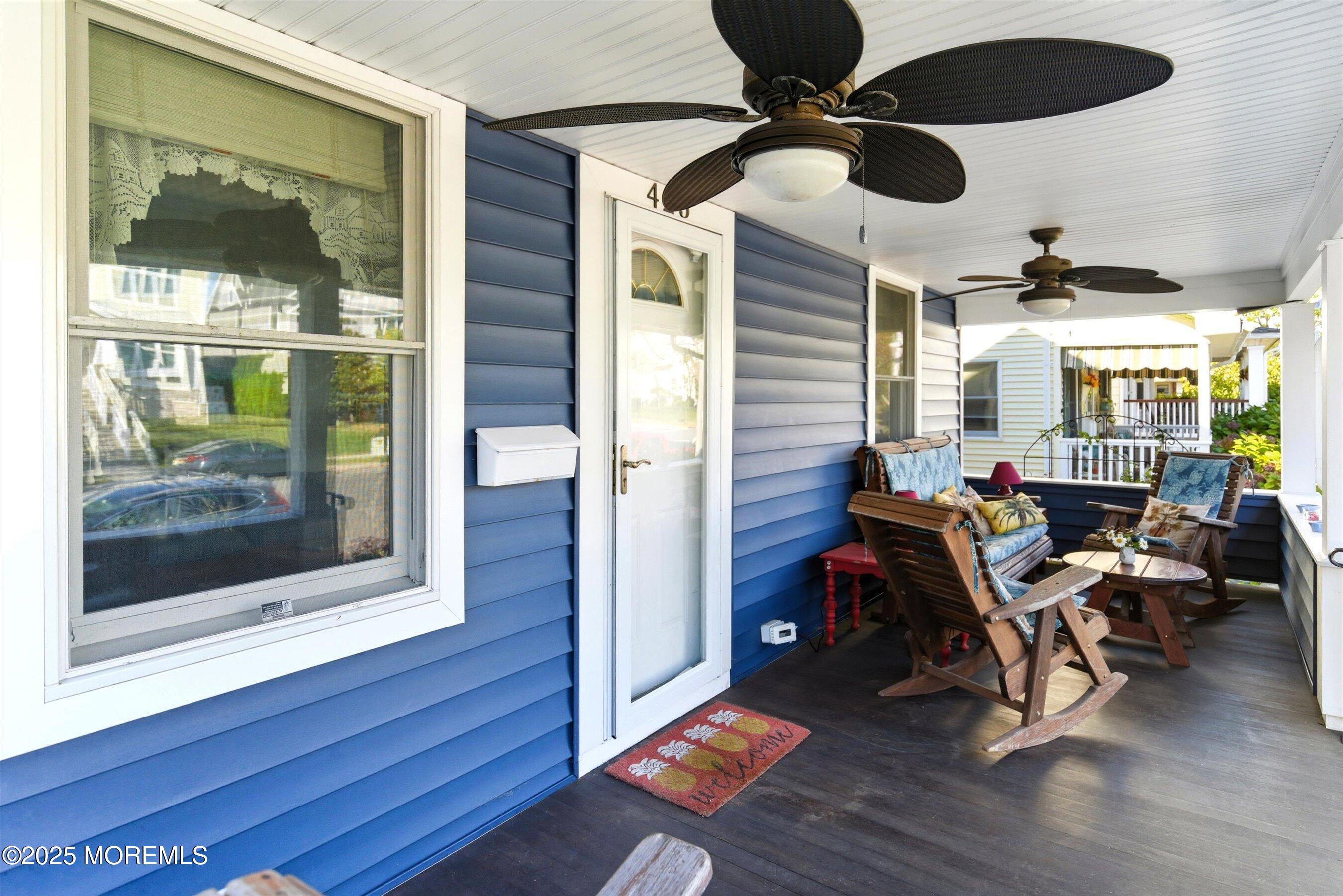 425 Washington Avenue Avon-by-the-Sea, NJ 07717 - Photo 6 of 41 a living room with furniture and a floor to ceiling window