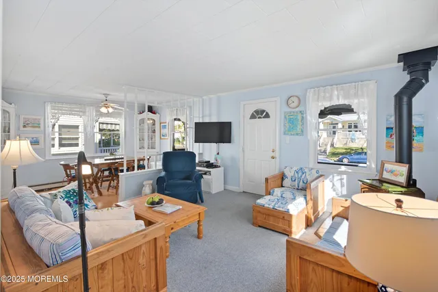 a living room with furniture and flat screen tv