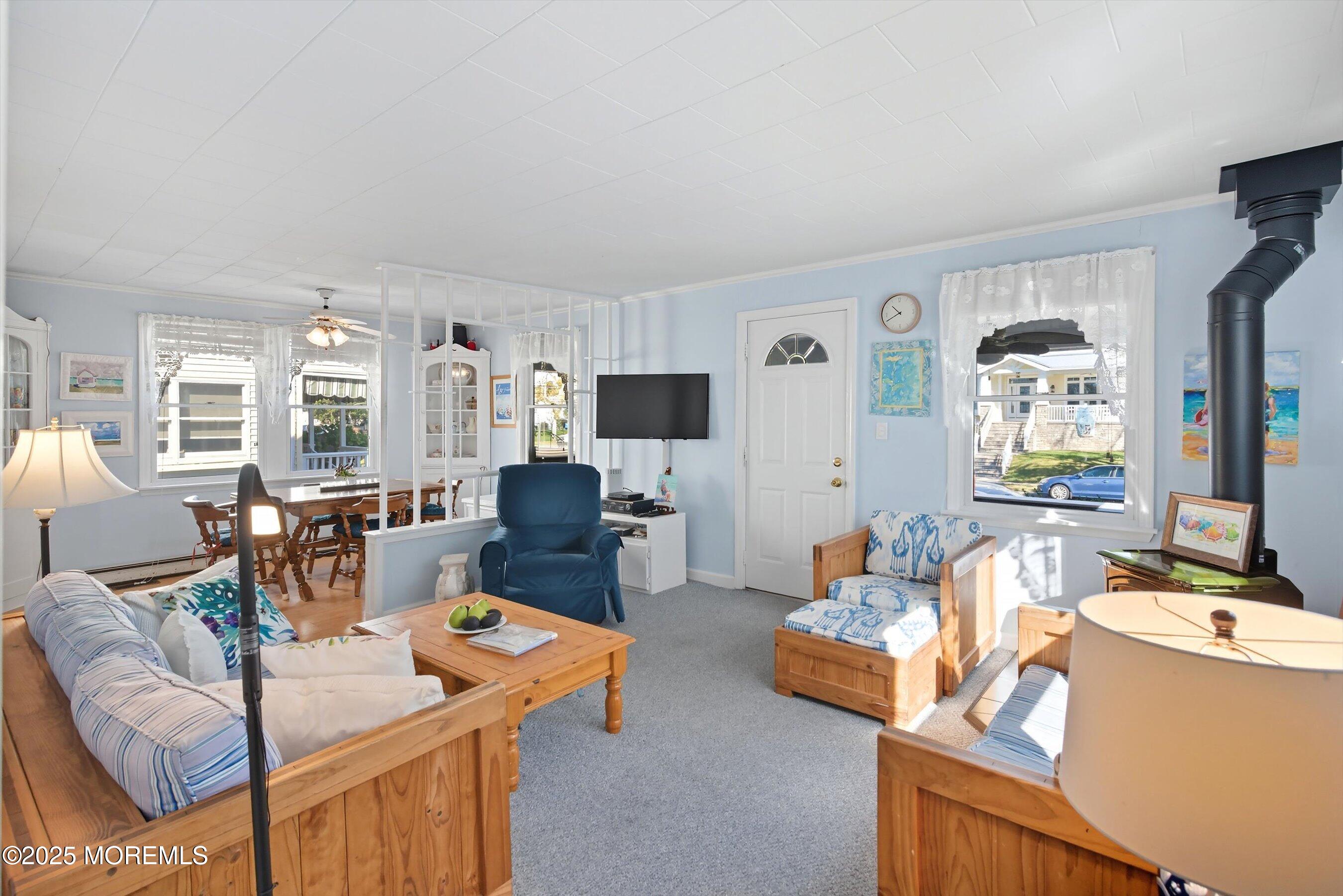 425 Washington Avenue Avon-by-the-Sea, NJ 07717 - Photo 9 of 41 a living room with furniture and flat screen tv