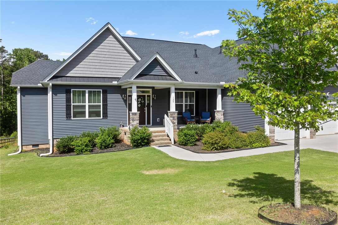 125 Estateside Drive Anderson, SC 29621 - Photo 3 of 37 A welcoming front porch with stone accents creates appealing curb appeal for this charming residence.
