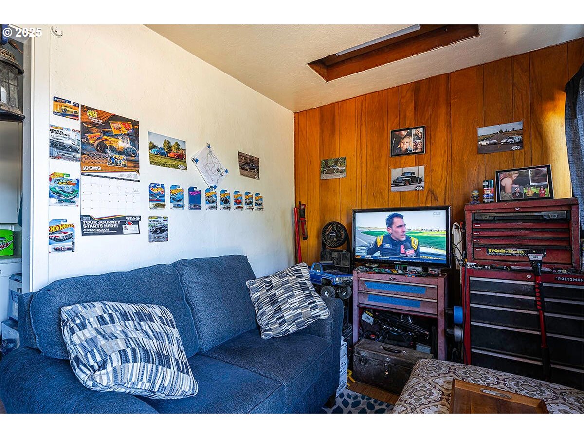 166 Reager Street Medford, OR 97501 - Photo 11 of 43 a living room with furniture and a flat screen tv