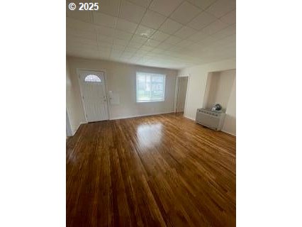 166 Reager Street Medford, OR 97501 - Photo 16 of 43 a view of an empty room with wooden floor and a window