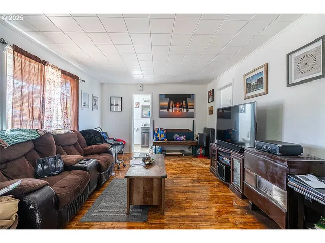 a kitchen view of a dining table chairs and entryway