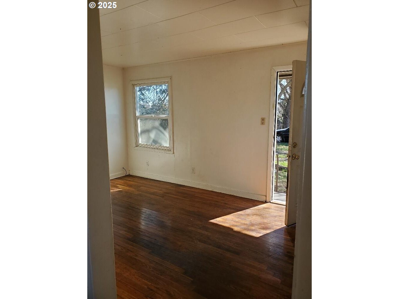 166 Reager Street Medford, OR 97501 - Photo 30 of 43 a view of an empty room with wooden floor and a window