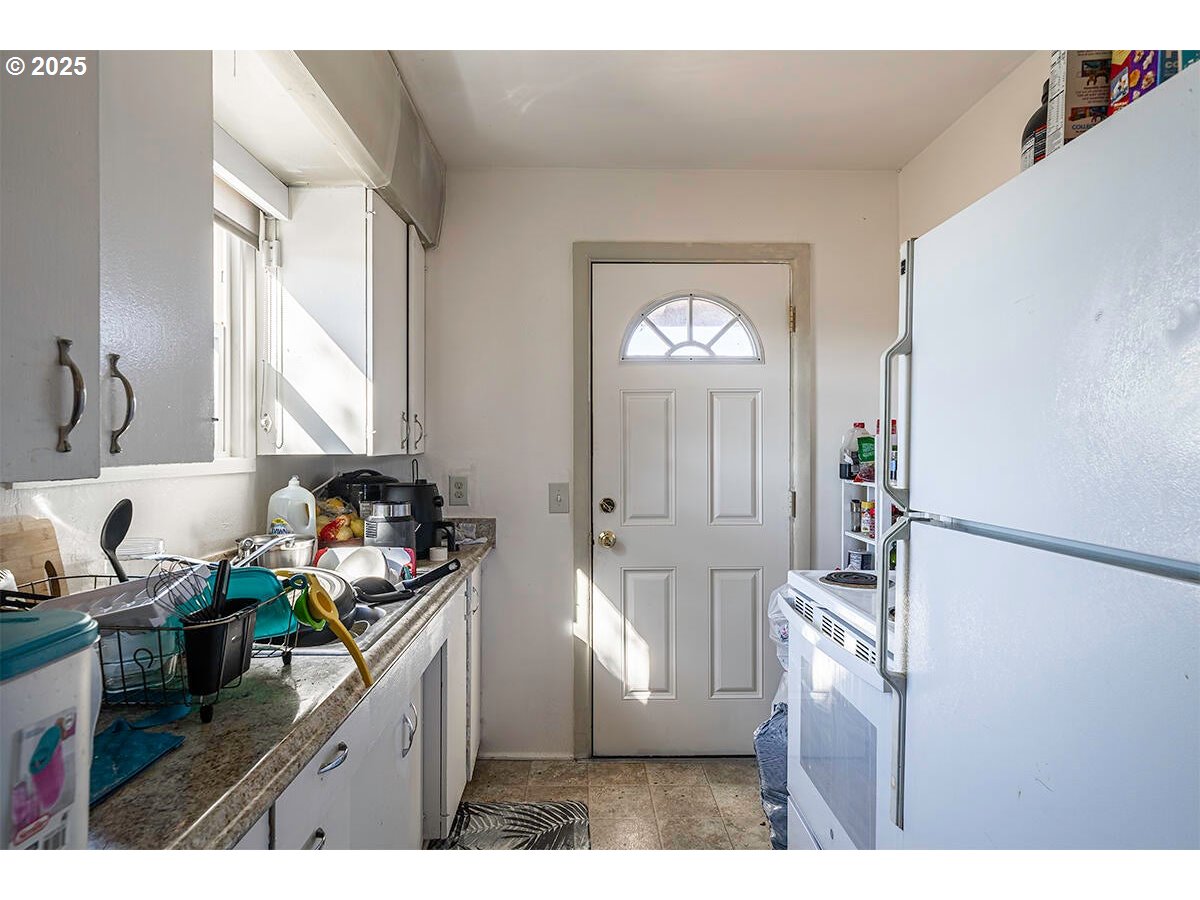 166 Reager Street Medford, OR 97501 - Photo 8 of 43 a kitchen with stainless steel appliances granite countertop a refrigerator sink and stove