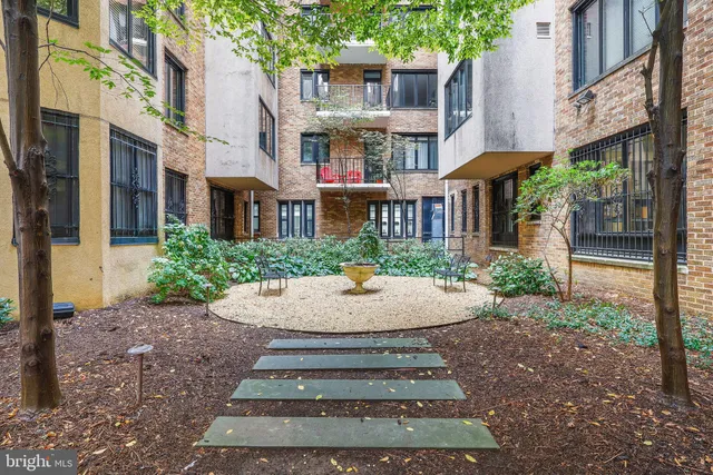 a view of a building with sitting area