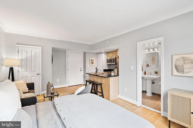 a bedroom with a bed and a table in it