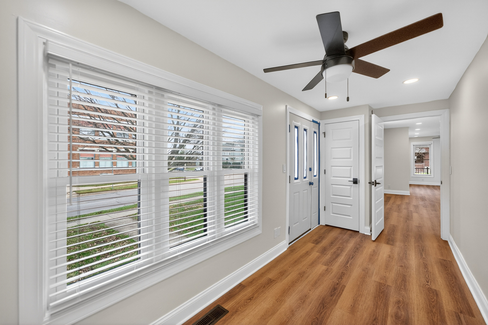305 West Exchange Street, Unit A Sycamore, IL 60178 - Photo 20 of 27 a view of hallway with a large window and wooden floor
