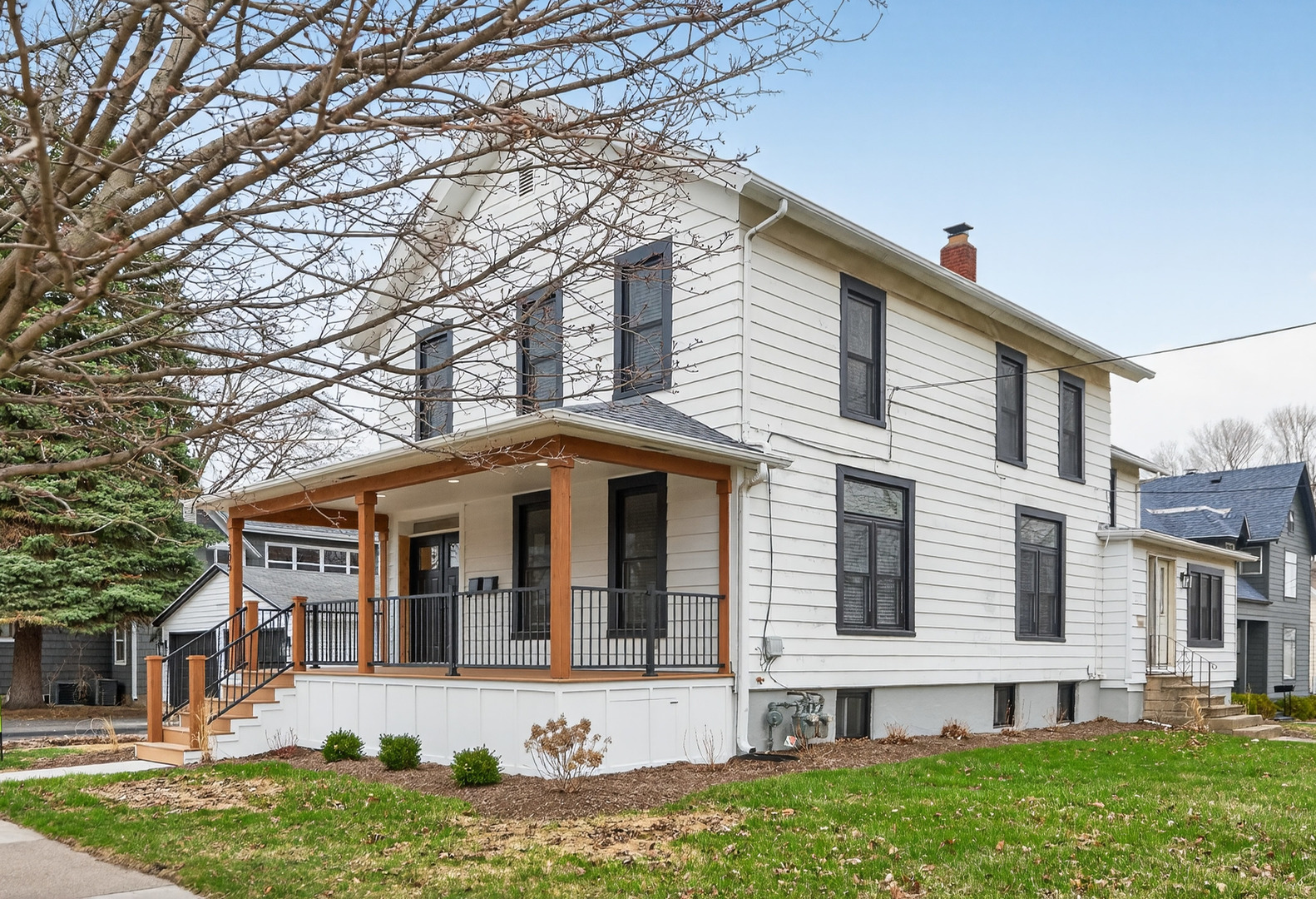 305 West Exchange Street, Unit A Sycamore, IL 60178 - Photo 2 of 27 front view of a house with a yard