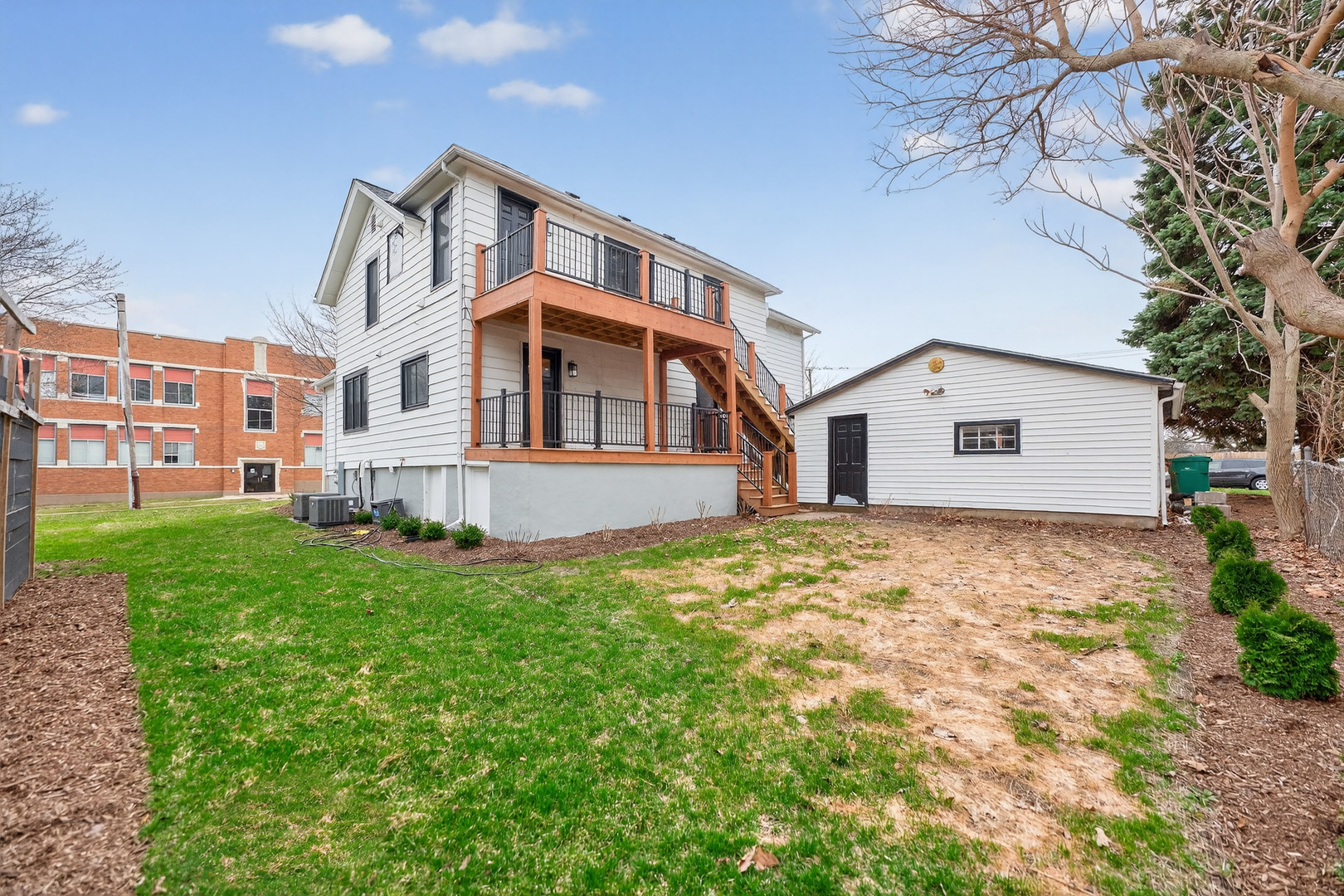 305 West Exchange Street, Unit A Sycamore, IL 60178 - Photo 25 of 27 a front view of a house with a garden