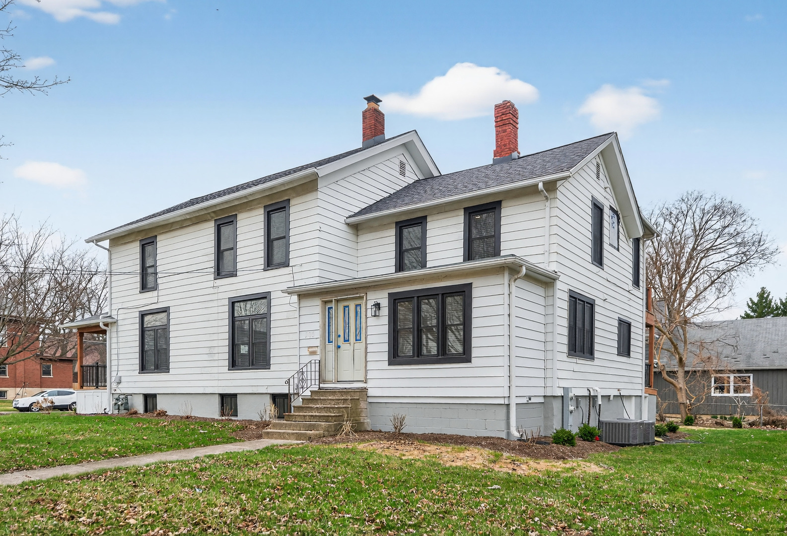 305 West Exchange Street, Unit A Sycamore, IL 60178 - Photo 26 of 27 a view of a house with a yard