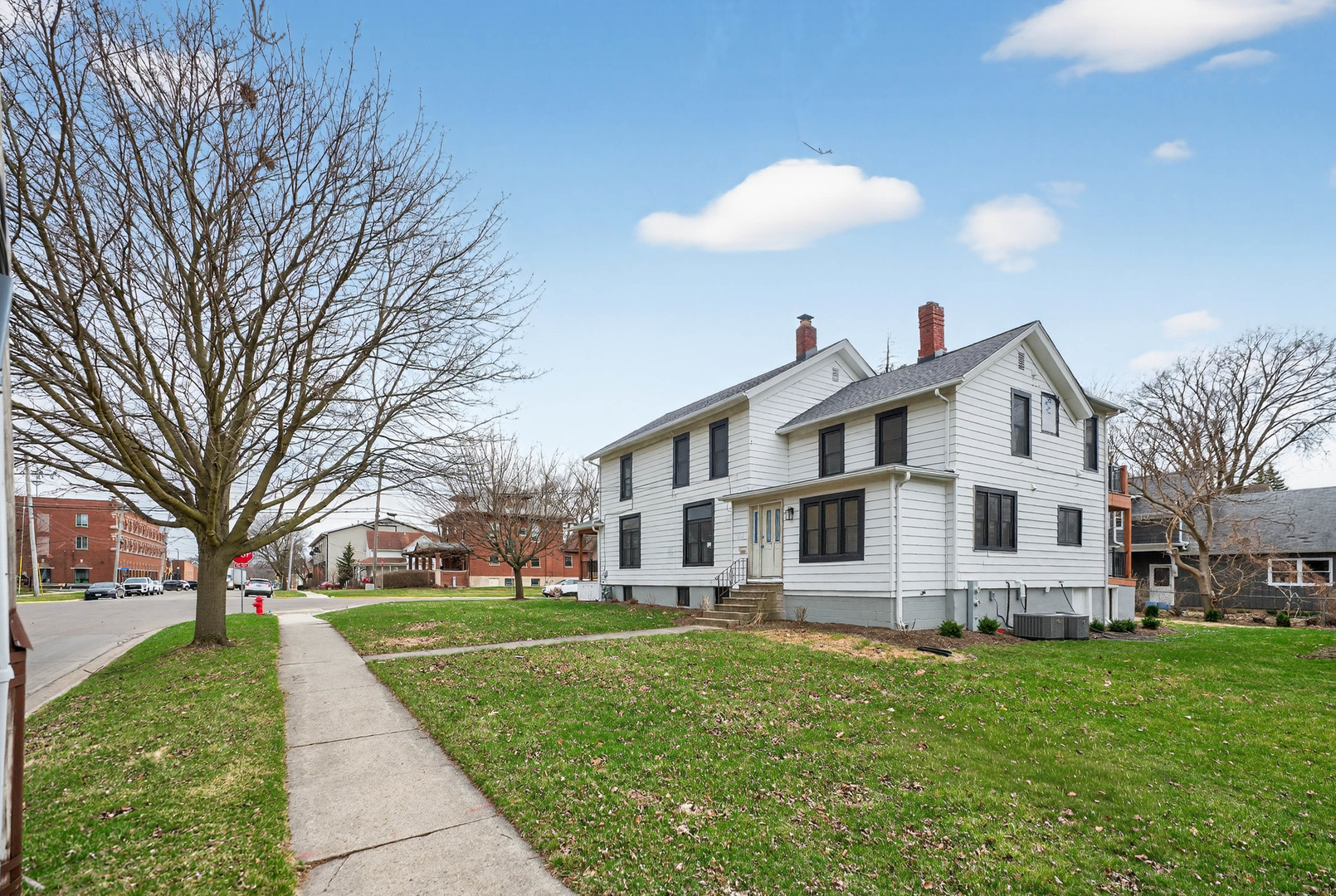 305 West Exchange Street, Unit A Sycamore, IL 60178 - Photo 27 of 27 a front view of a house with a yard